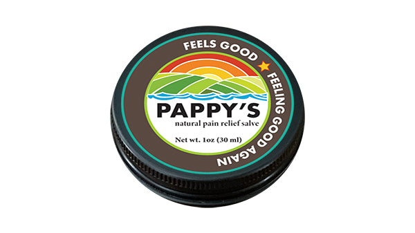 Top view of a one ounce black Pappy's tin with the brown product label that is an image of  sunset behind rolling hills and the a river